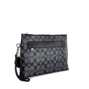 27. Coach Carryall Pouch in Signature